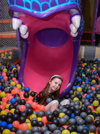 A happy smile from the bottom of our monster slide. It's one of our most popular attractions for a reason!