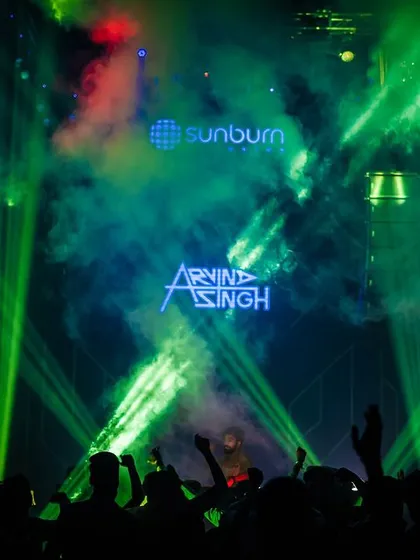 A stunning shot of the laser show at Sunburn Union, with my name lit up on the screen. My full AV setup is designed to create moments like this.