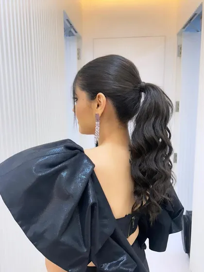 The back of the sleek high ponytail, showing its clean lines and elegant shape.