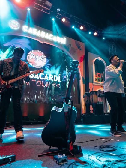 A cool shot from the Casa Bacardi show in Jaipur. You can see my guitarist in action while I'm on vocals. Our band's synergy is a huge part of our live sound.