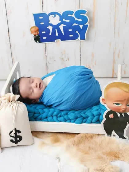 Let's have some fun! My studio is filled with creative props to bring any theme to life, like this playful 'Boss Baby' setup. It's a wonderful way to show your baby's budding personality.