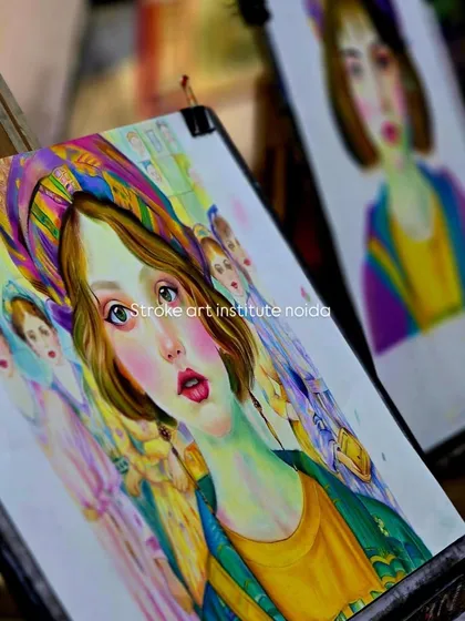 Two student projects side-by-side on easels. This image showcases the progress and beautiful results of our soft pastel portrait workshops.