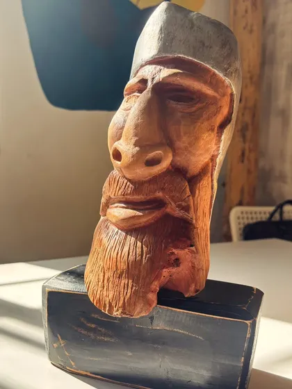The grain and groove of wood hold so much character. This hand-carved wooden sculpture is a testament to quiet resilience, with every detail carefully shaped to bring a story out of the pine wood.