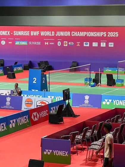 The venue setup for the BWF World Junior Championships, showing the branded court surroundings and seating arrangements we managed.