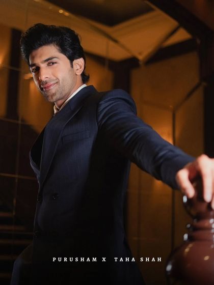 Another shot of Taha Shah, exuding confidence in a classic tailored suit. It's a look that is both timeless and powerful.