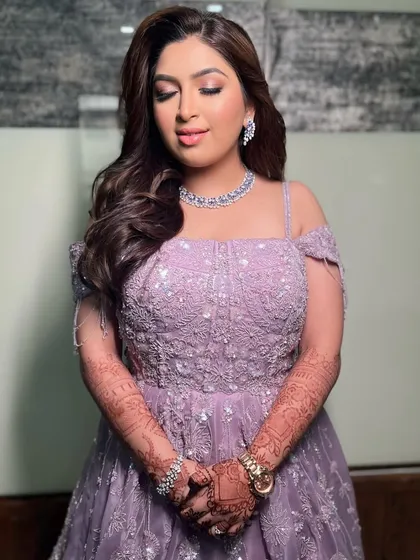 A beautiful reception bride with her hair in soft, off-the-shoulder waves.