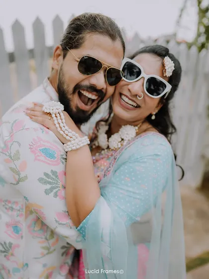 A joyful, sun-kissed hug. The energy and happiness of a Haldi ceremony are perfectly captured in this candid shot.