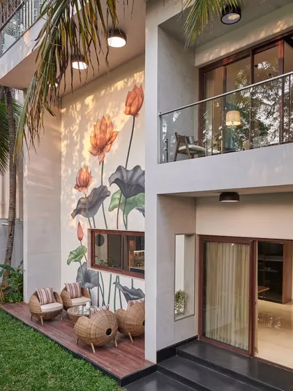 A touch of tranquility for a private residence. This serene lotus mural turns a garden patio into a peaceful retreat, showing how custom wall art can completely transform the feeling of a home.