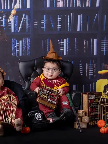 Double the magic! A pair of twins dressed in Harry Potter outfits for their six-month sitter session.
