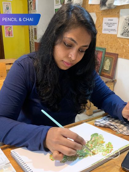 Deep in concentration, a student adds fine details to a leaf study. This quiet focus is a hallmark of our classroom, where every artist is encouraged to grow at their own pace.