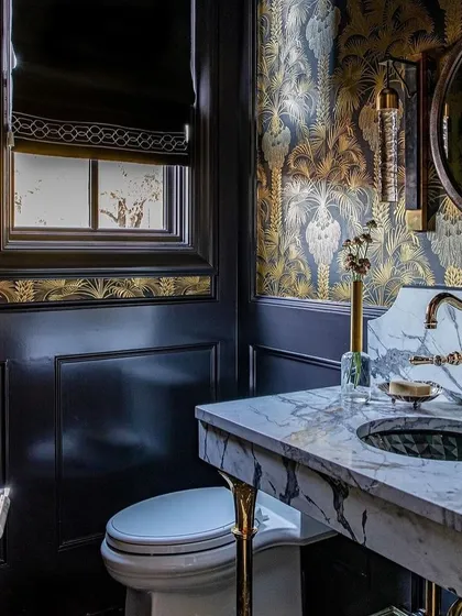 Experience the pinnacle of design with luxurious wallcoverings that make a statement. This powder room, featuring the Hollywood Palm wallpaper, is a perfect example of how to transform a space into a masterpiece of sophisticated style.