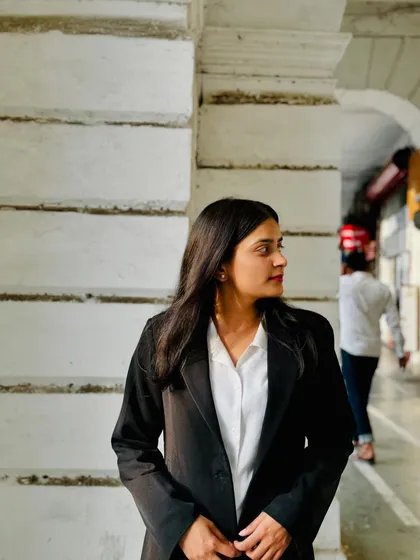 A thoughtful profile against a classic backdrop. My practice is a blend of modern techniques and timeless legal principles.