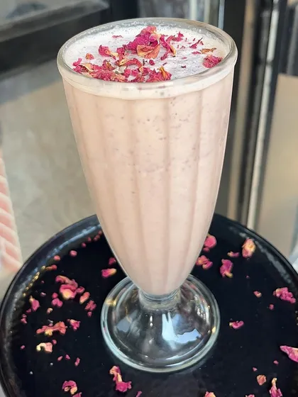 Another look at my beautiful and delicious Gulabo milkshake, garnished with rose petals.