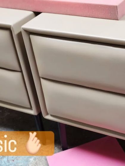 A classic and elegant choice. This pair of side tables features soft, upholstered drawer fronts in a neutral beige tone with a clean, modern silhouette.