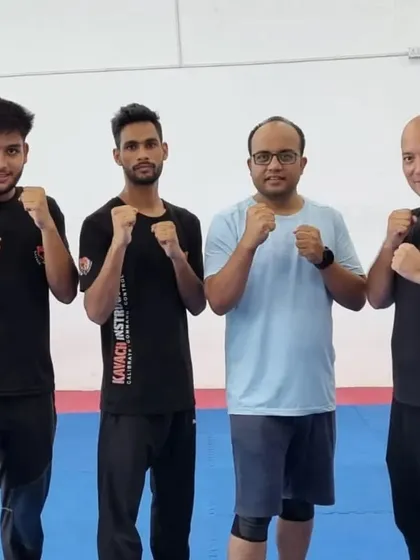 A group of male participants and instructors after a training session.
