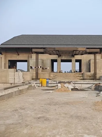 The main structure of our luxury villa project in Bhubaneswar taking shape. This image captures the building's strong, grounded presence and the initial framework that will eventually become an elegant farmhouse blending comfort with sophisticated design.