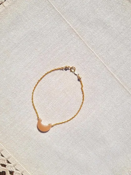 Another view of the 'kháray' peach moonstone Luna bracelet. This piece is designed to bring peace and calm while attracting abundance and good fortune in love.