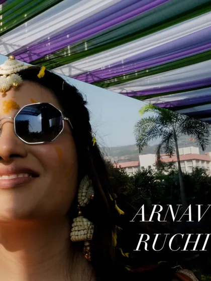 The bride looking cool and chic in sunglasses during her haldi, a fun portrait that captures her personality.