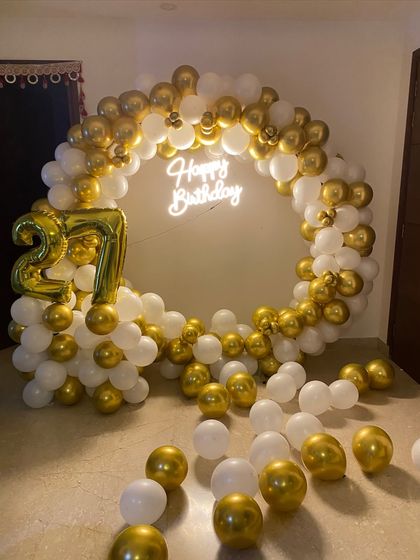 The gold foil '27' balloon is a great alternative to marquee numbers for a more budget-friendly but still impactful birthday backdrop.