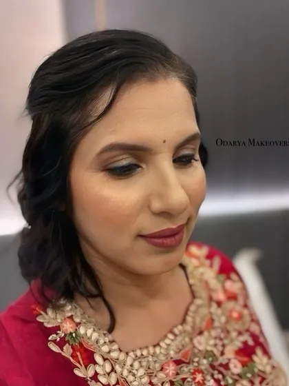 A close-up of the makeup, showing the soft eye makeup and the perfectly blended base.