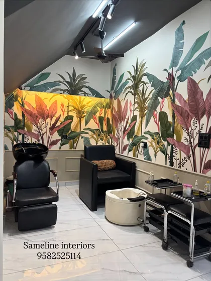 For the shampoo and pedicure section, we used a vibrant, tropical wallpaper and lower wall moulding to create a distinct, relaxing zone. Even in a small corner, we designed a space that feels like a mini-getaway for clients.