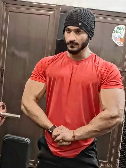 A simple pose showing arm and chest gains.