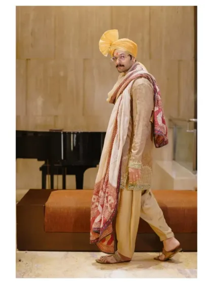 The groom in motion, captured in a confident stride. This dynamic portrait shows his readiness to step into his new life.