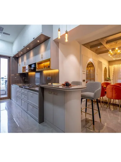This open-concept design seamlessly connects the kitchen, breakfast bar, and dining area, creating a fluid and social heart of the home. We focused on a sophisticated grey palette, layered lighting, and high-end finishes to merge functionality with timeless style.