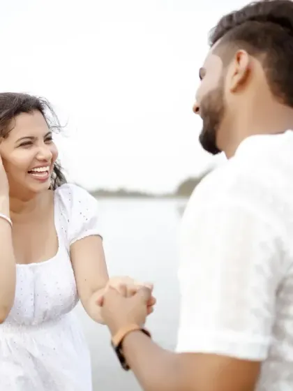A tender moment on the beach, with the couple dressed in white. This pre-wedding shot is pure, simple, and full of love.