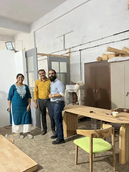 A happy client visiting my workshop to see their new dining table and chair. I always welcome clients to see their furniture in person before delivery. It’s the best way to ensure they are completely satisfied with the craftsmanship.