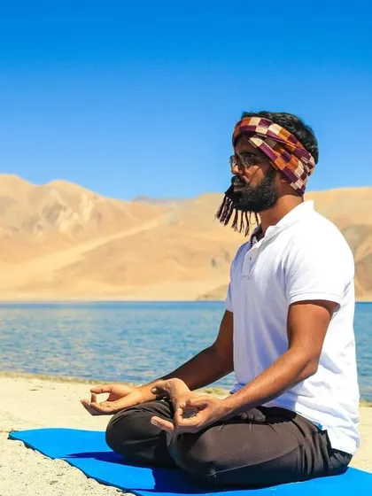 Meditating by the sacred, high-altitude lake of Pangong Tso in Ladakh. Practicing in the lap of nature is a profound experience that cleanses the mind and soul. I bring the peace and clarity from these moments into every class I teach.