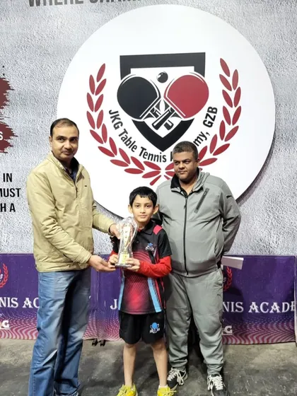 Aryaveer Borah, our U-11 Boys Gold Medalist, with his trophy at the JKG Open Tournament.