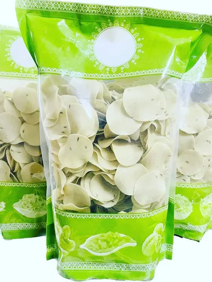 I also have these small, coin-sized rice papads. This is the Jeera flavor, which is mildly spiced and very addictive. They are easy to fry and make a great snack for parties or tea time.