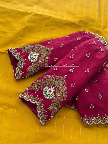 A close look at the detailed handwork on the elbow-length sleeves of a magenta raw silk blouse. This is my signature jewellery concept, where zardosi, kemp stones, and beadwork are combined to mimic the grandeur of a traditional necklace.