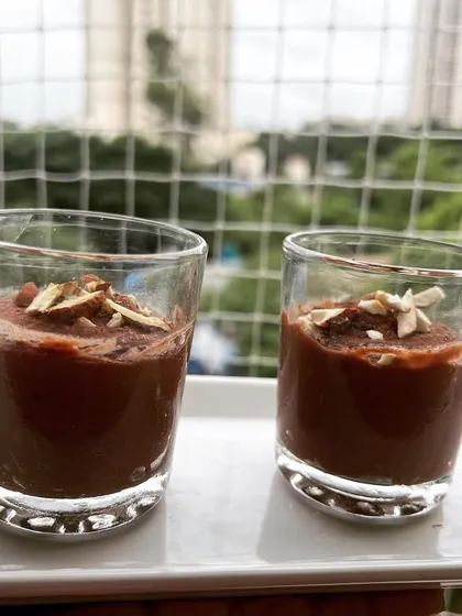 My plant-based chocolate mousse is perfect for all ages, including kids. Made with sweet potato and cacao, it's a delicious and healthy dessert served in individual glasses and topped with slivered almonds.