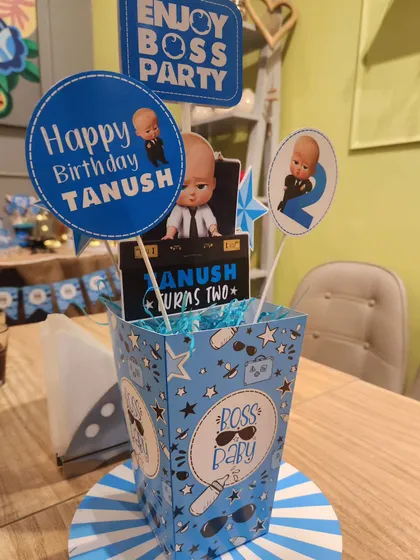 A themed centerpiece for the Boss Baby party, holding treats and adding to the decor.