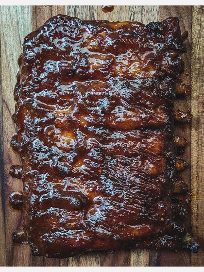 Another shot of the Barbeque Pork Ribs, highlighting the tender meat and rich, smoky glaze.