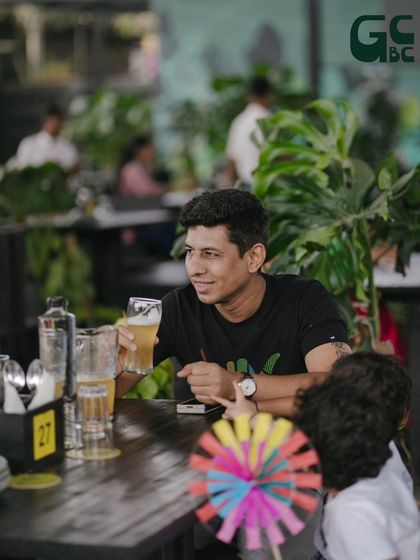 A guest enjoying a chilled beer and the relaxed Sunday atmosphere at our restaurant.