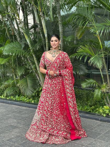Another angle of this beautiful bride, showing how the complete look comes together with the dupatta setting. The makeup remains flawless and radiant even from a distance.