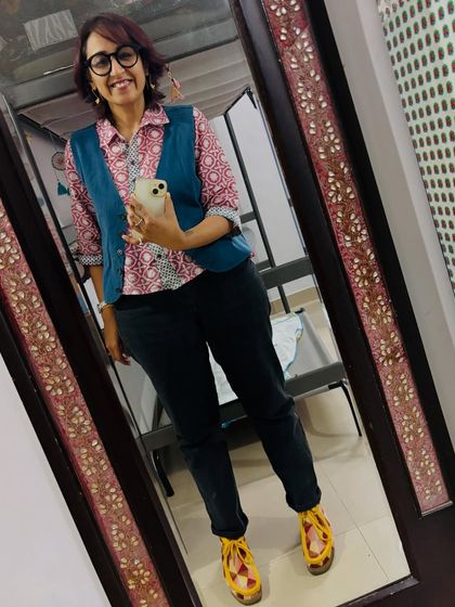 A full-body shot showing how I styled the block-print kurta with black jeans and a waistcoat.