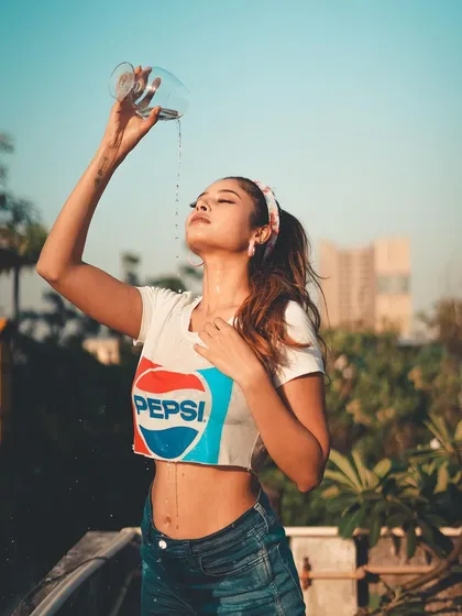 This was a fun, high-energy concept playing with a retro Pepsi theme. The action of pouring the water adds a dynamic and refreshing feel to the portrait.