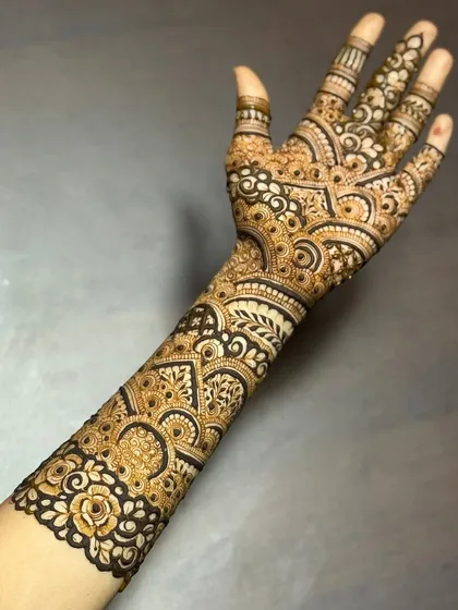 The back of the hand and arm, showing how the design wraps around for a complete, stunning look.