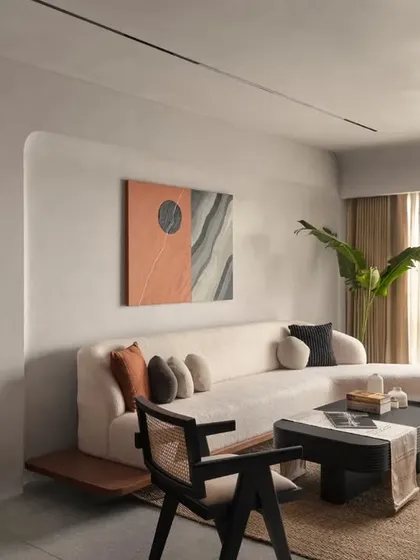 Natural light floods this living room, highlighting the soft texture of the boucle sofa and the clean lines of the custom furniture. I design spaces that feel both sophisticated and comfortable, perfect for everyday living.