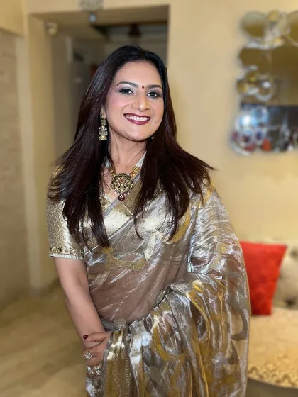 A smiling portrait that shows off her beautiful makeup and confident energy. The look is perfect for a party or festive celebration.