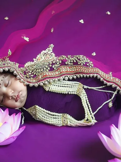 A sleeping goddess. This newborn session was for Navratri, and I styled her as a divine little Devi, complete with a beautiful purple wrap, traditional jewelry, and lotus flowers. It’s a precious way to celebrate your baby's arrival during the festive season.