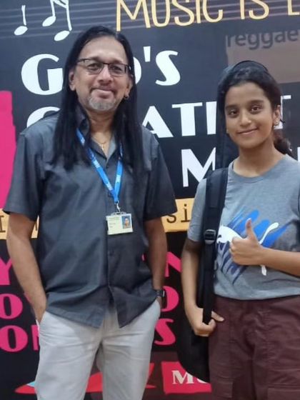 Our student Aakanksha with the examiner from Rockschool London. A proud moment for our school.