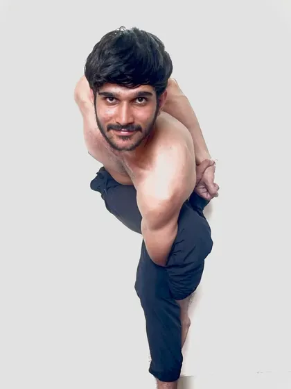 A standing twist with a bind, a pose that detoxifies the body and improves balance.