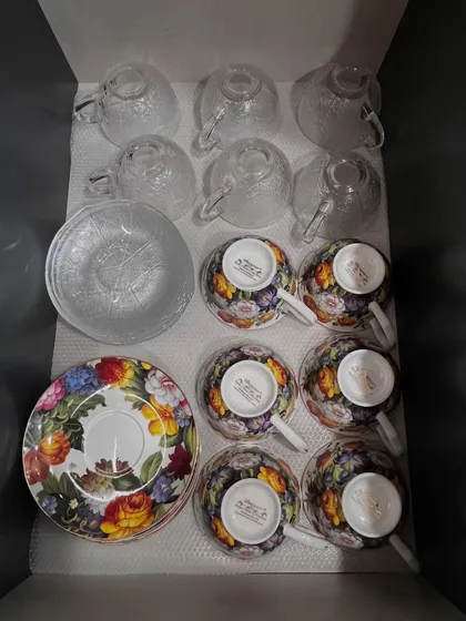 A close-up of a tea set being packed or unpacked. We handle all items with care, ensuring your precious crockery is safe during the organization process.