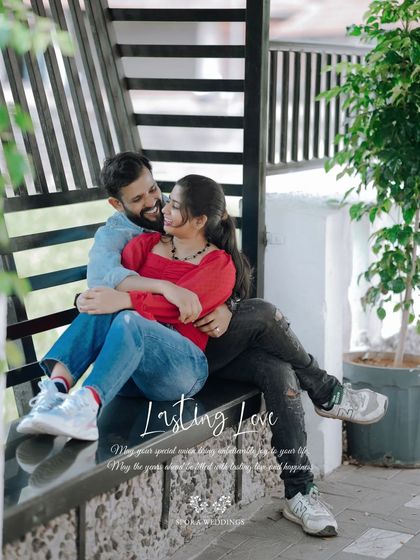 The couple cuddling on a bench, a perfect picture of "Lasting Love."