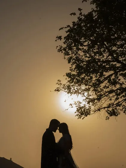 A classic sunset silhouette. This timeless and romantic shot is always a beautiful addition to any pre-wedding collection, capturing the mood of the golden hour.